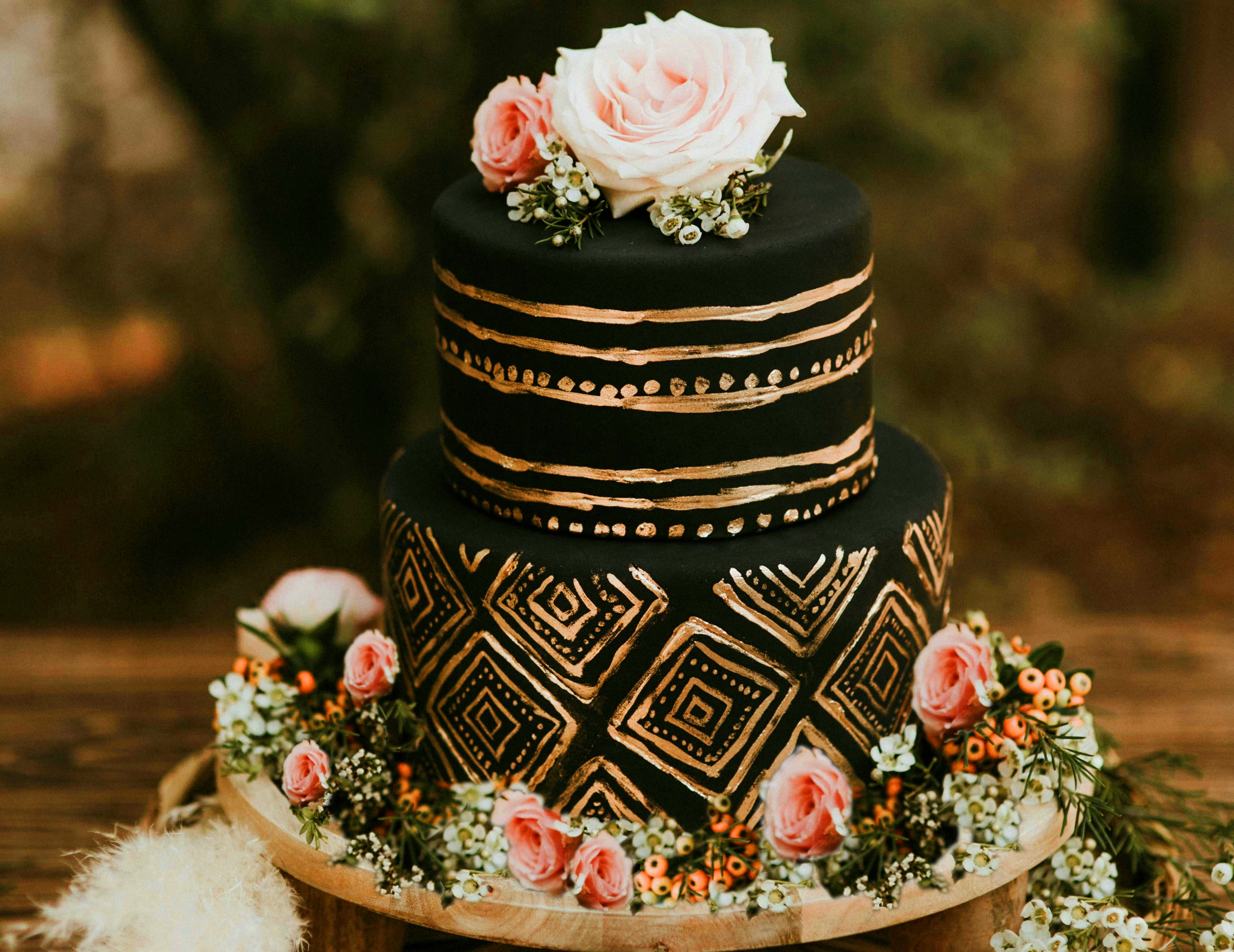 chocolate and gold tiered cake with flowers